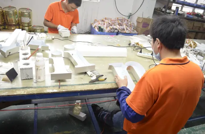 LED light assembly and testing line in custom signage factory