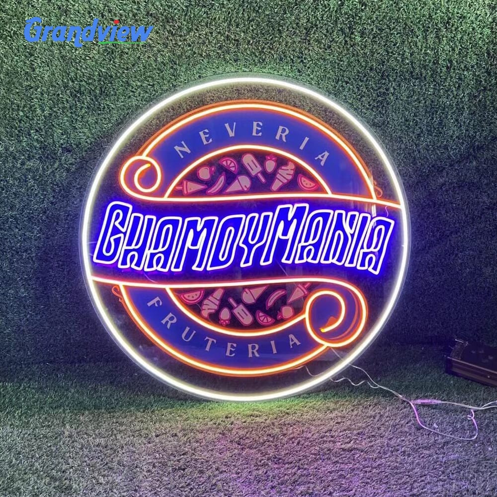 Custom 3D LED neon sign showing Chamoymania logo on artificial grass wall