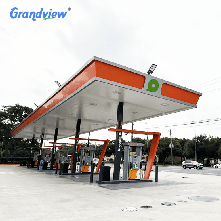 Custom steel space frame gas station canopy roof structure with orange fascia design by Grandview Factory