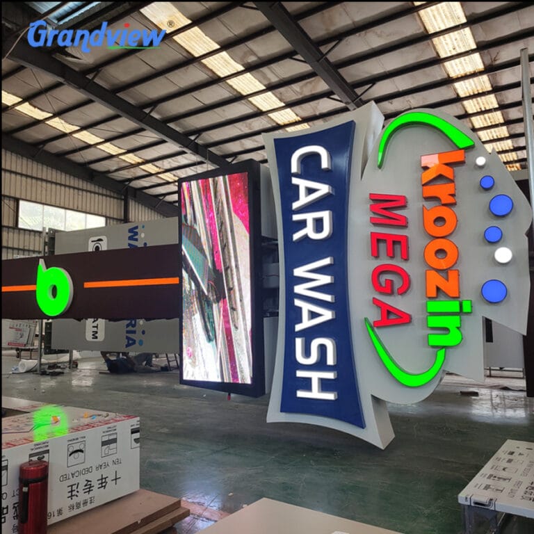 Custom outdoor digital pylon sign factory project for Kroozin Car Wash featuring large LED advertising screen and 3D letters