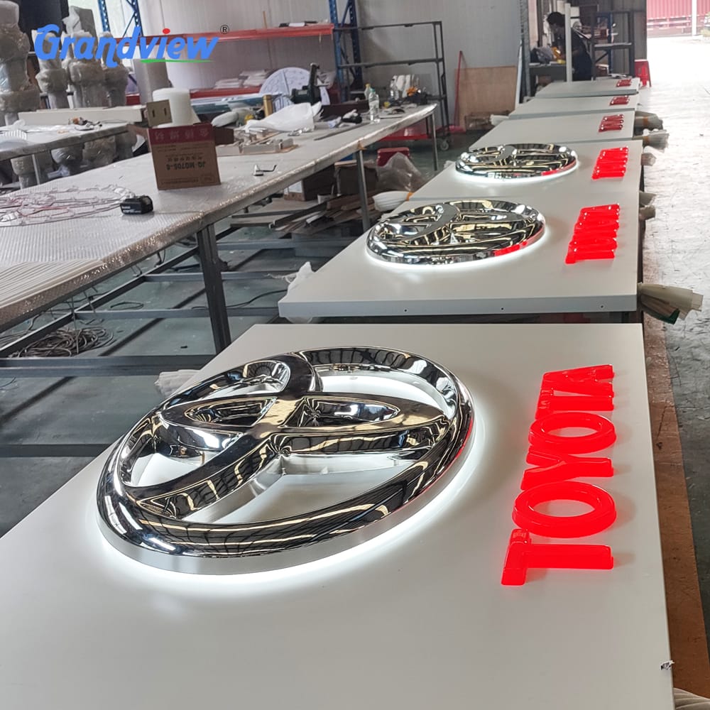 Grandview factory team assembling durable car dealership signage.