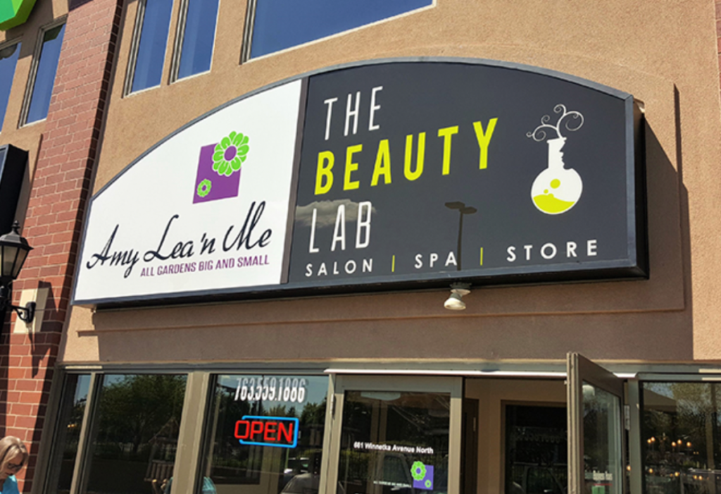 Custom wall-mounted cabinet sign for commercial business exterior.
