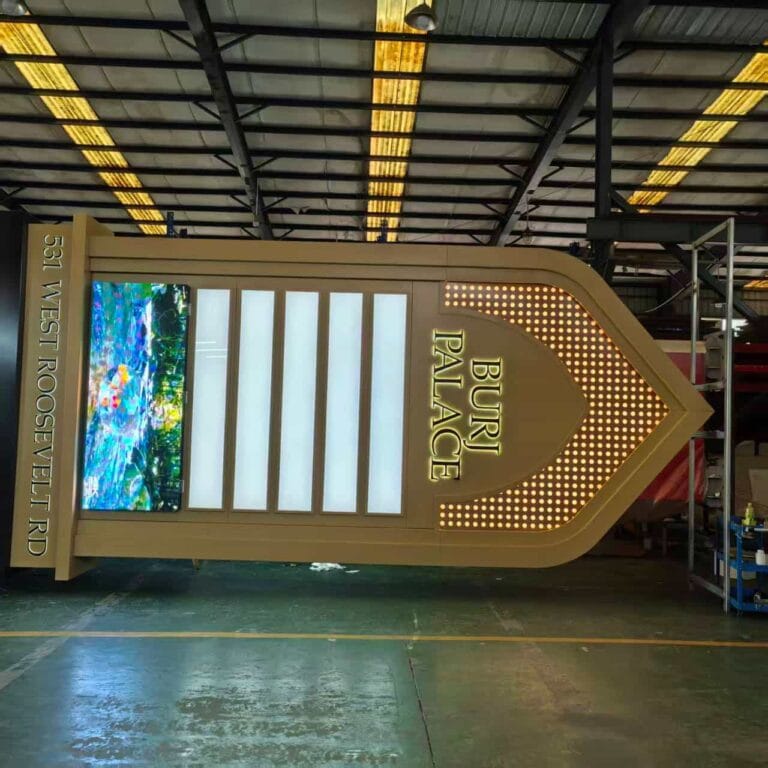 Large custom architectural pylon sign with integrated LED digital display screen in our manufacturing facility
