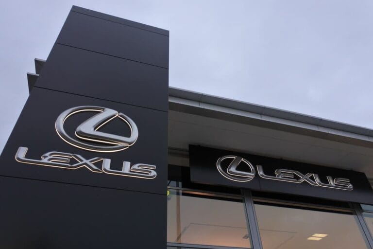 Premium outdoor building fascia and monument signage for Lexus car dealership