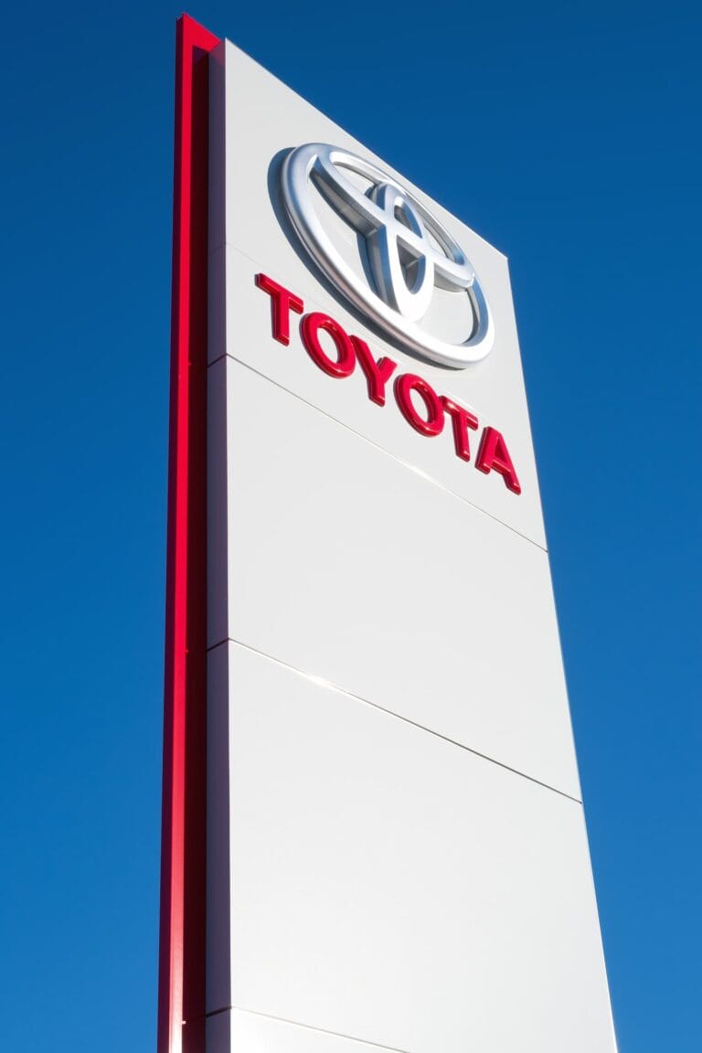 Custom outdoor illuminated pylon sign manufactured for Toyota automotive dealership