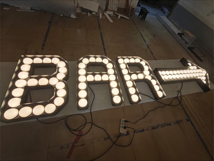 Custom vintage style illuminated marquee letters for bar signage manufactured in our facility