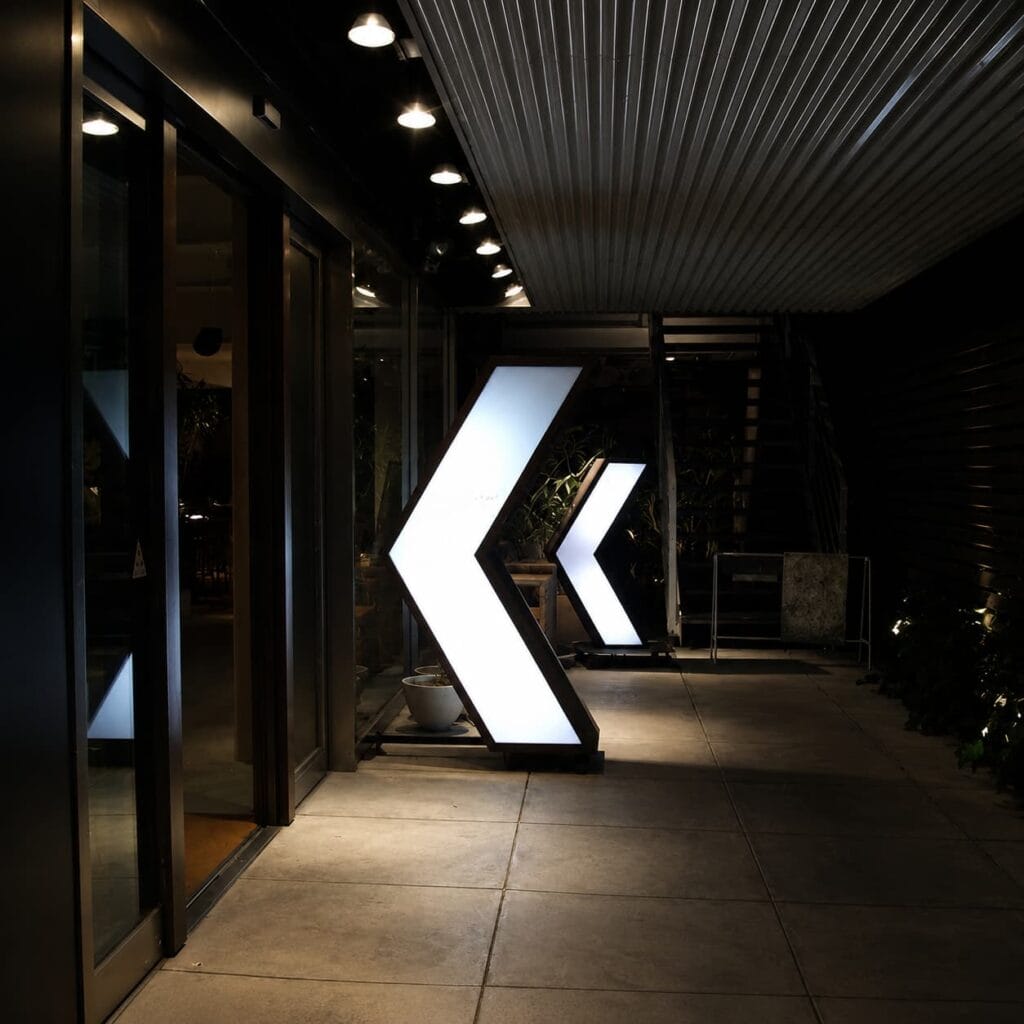 Large LED illuminated arrow directional wayfinding signs