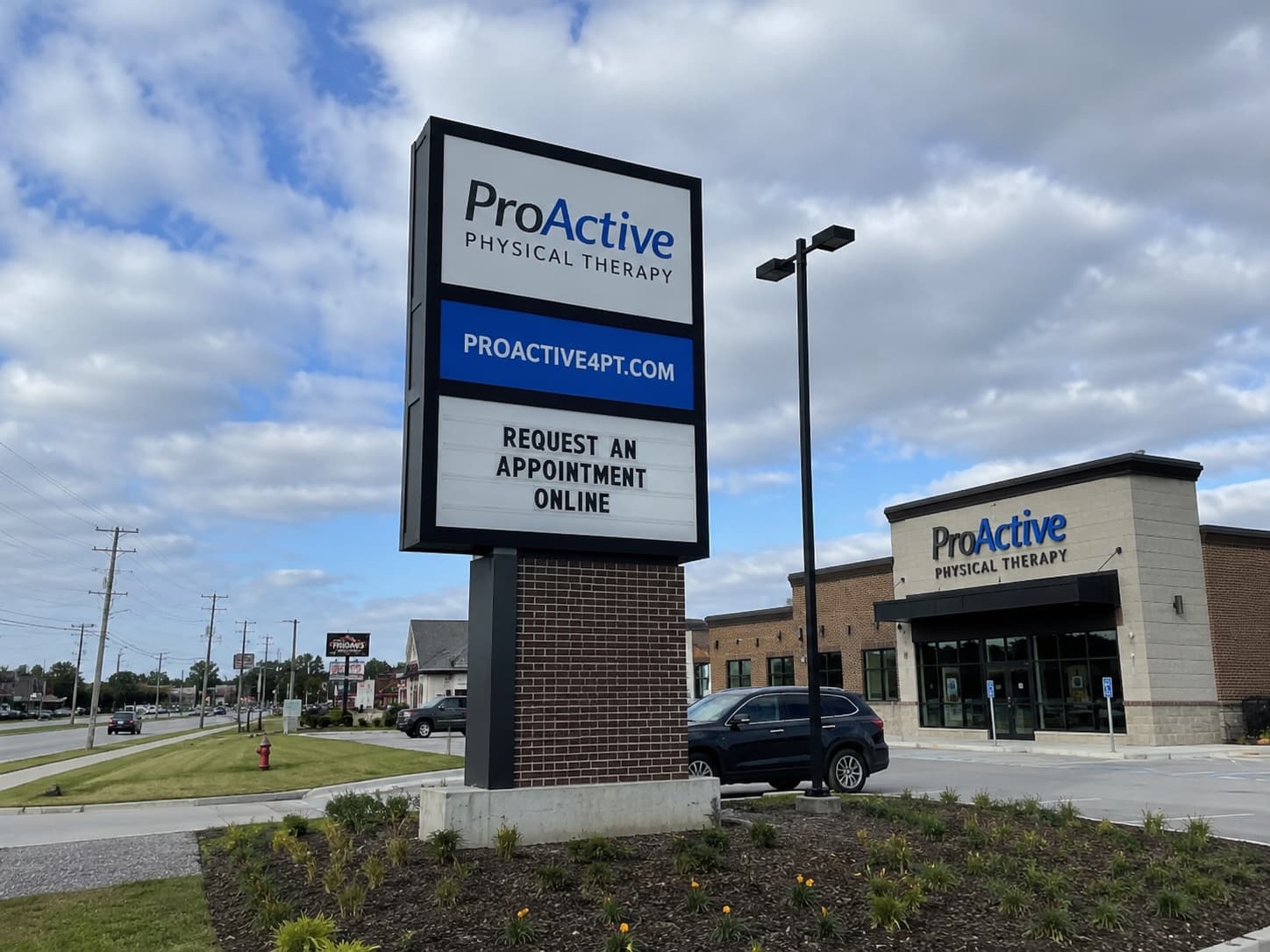 A completed commercial pylon sign should be reviewed in relation to the road, entrance, surrounding buildings, and viewing direction.